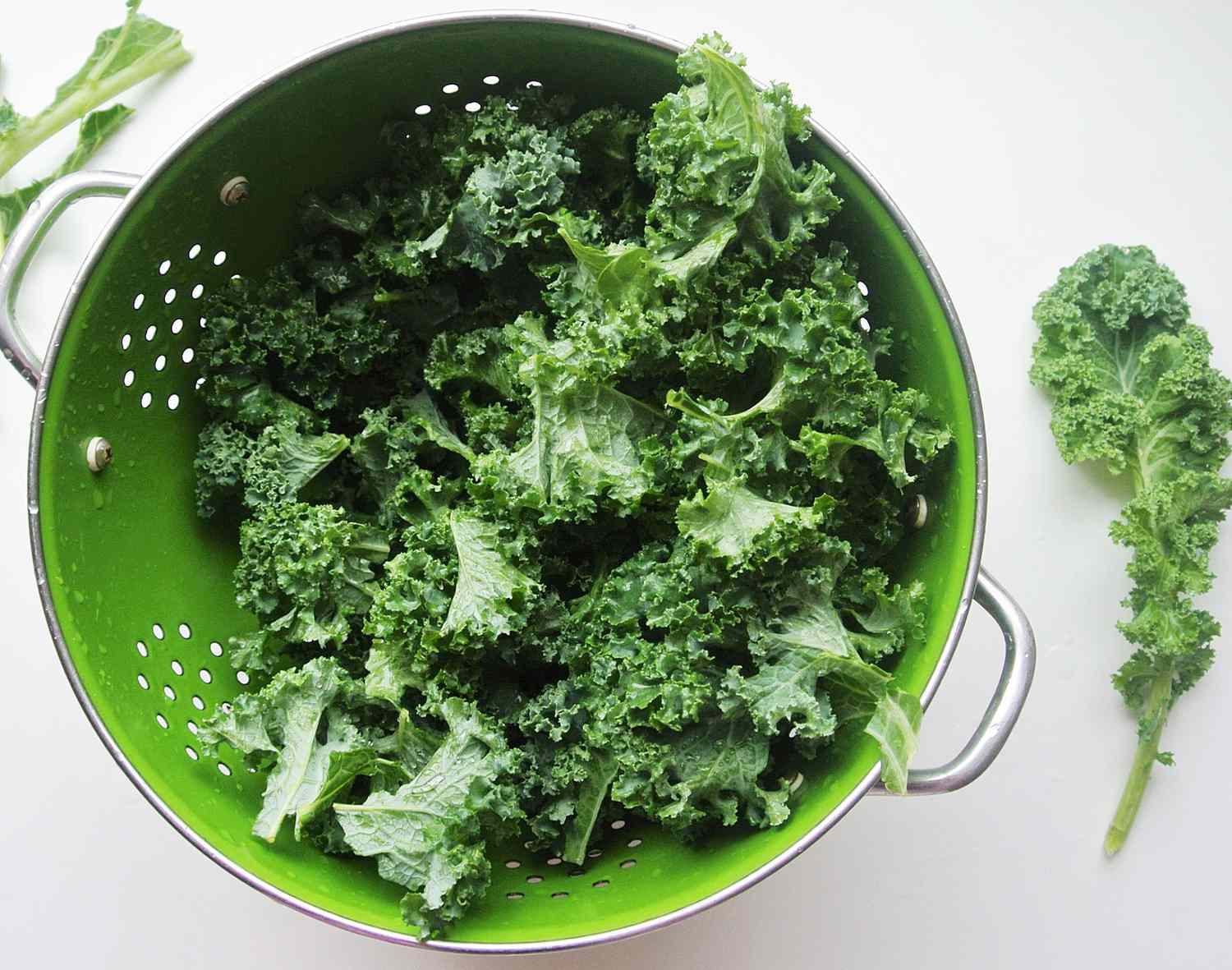 Kale in a green colander