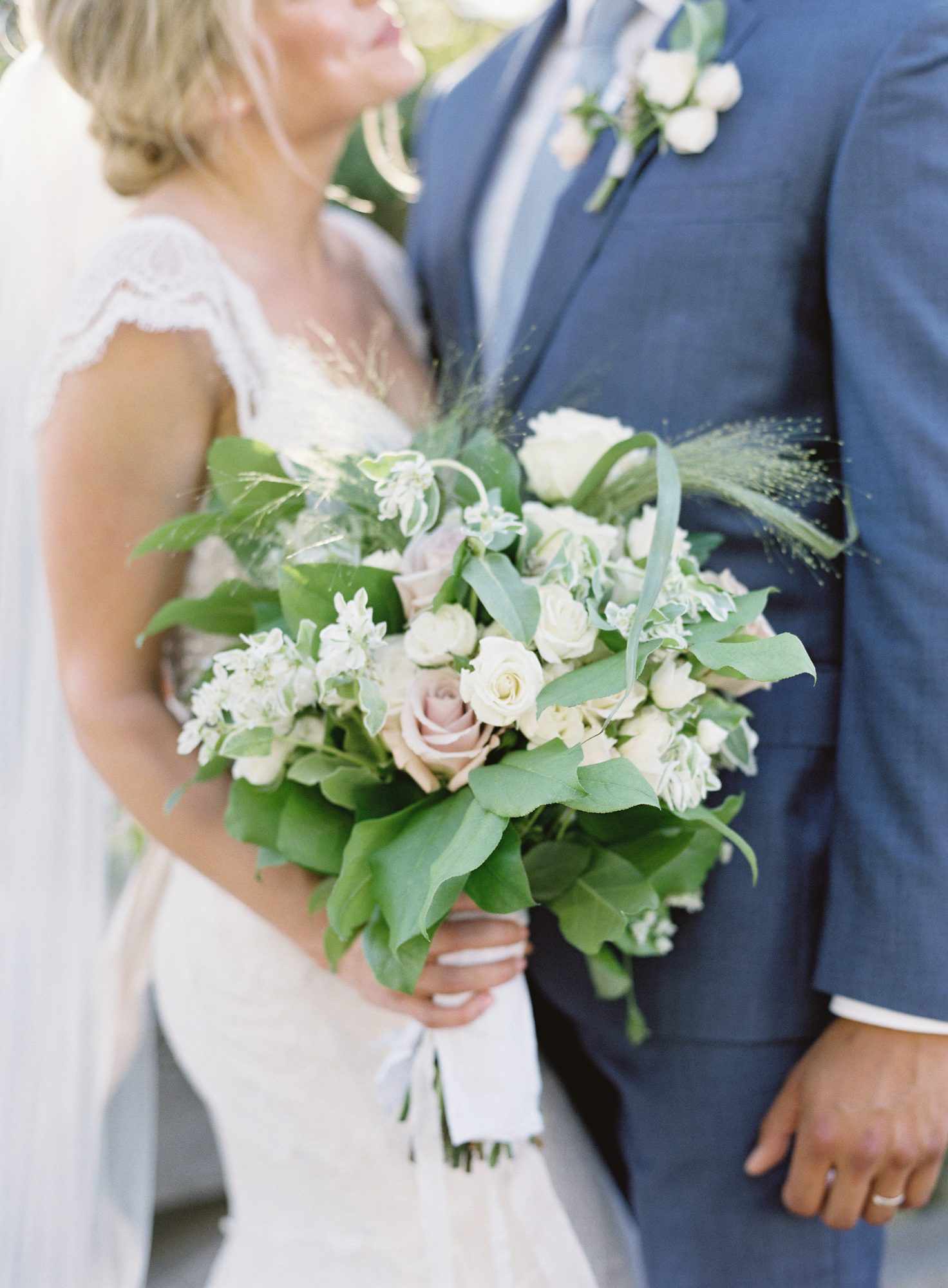 bride and groom with bouquet