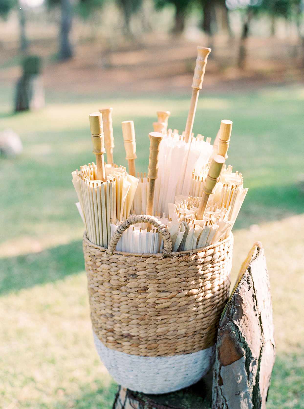 alyssa macia wedding woven basket of parasols