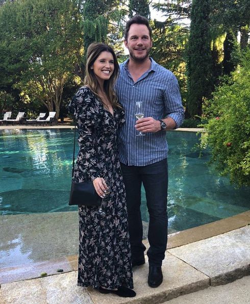 chris prayy katherine schwarzenegger standing by pool