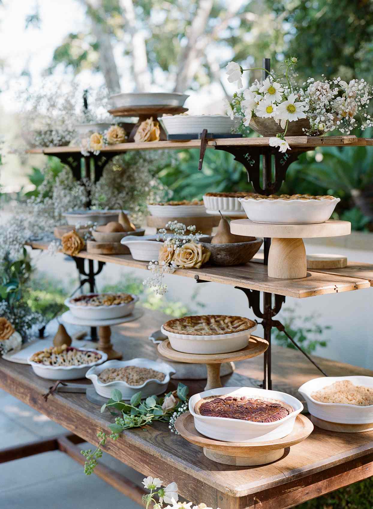 tiered table with various pies on display