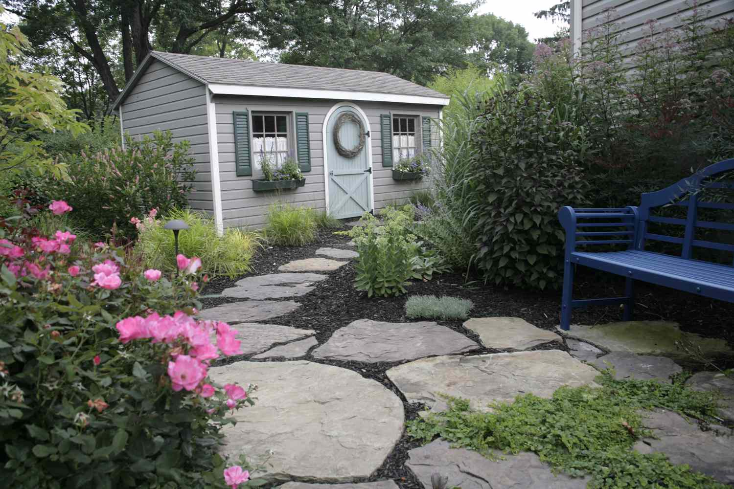 Large flagstone paver with mulch garden path