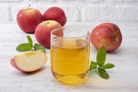 Apple juice in glass cup 
