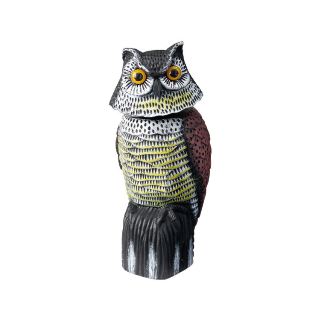 A decorative owl statue with a textured body facing forward