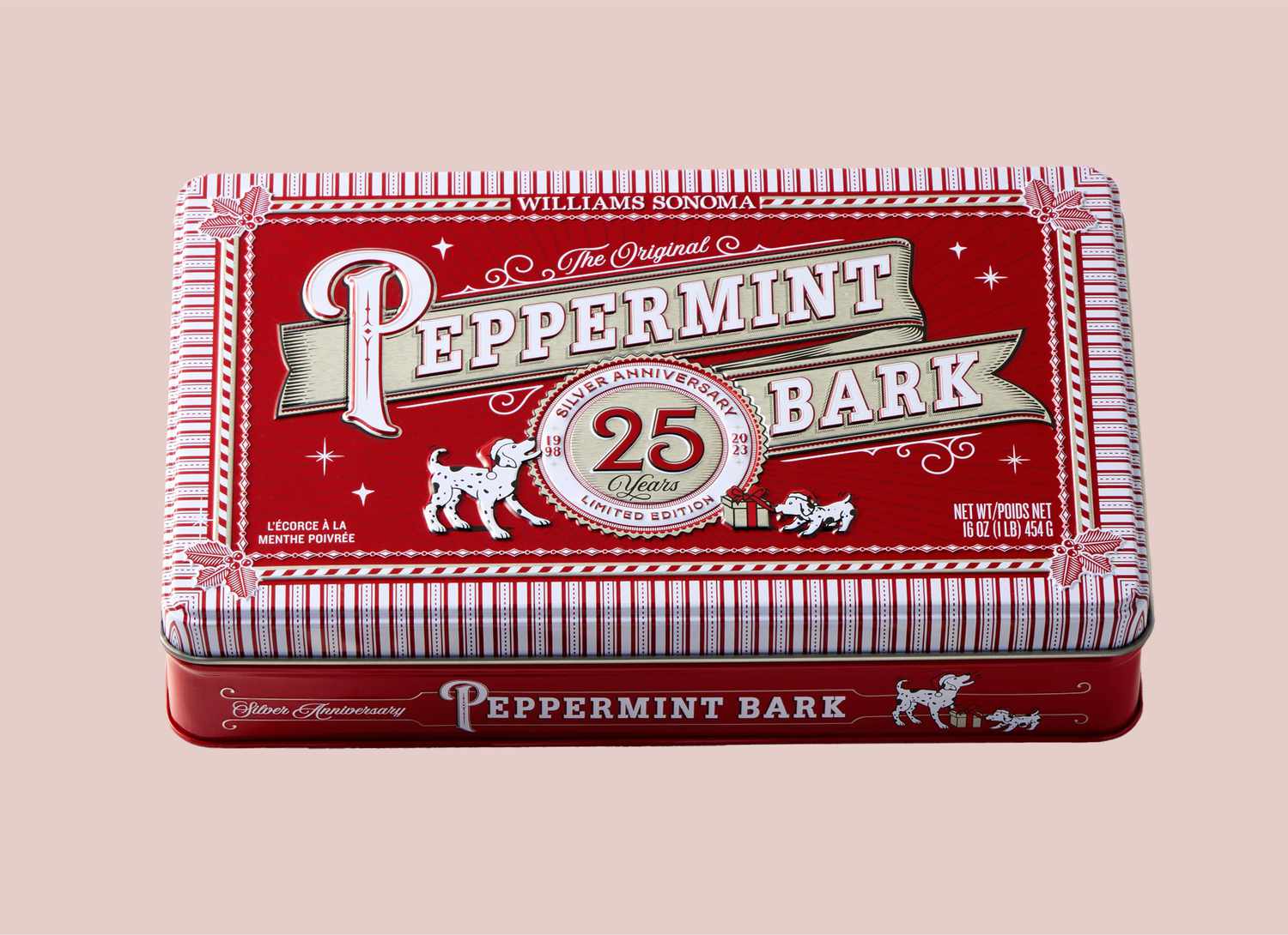 red tin of peppermint bark on a pink background
