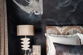 black bedroom wall with mural
