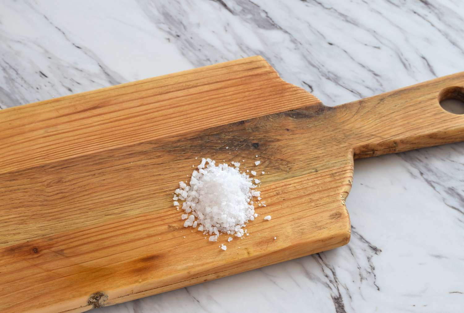 Salt on a wooden cutting board