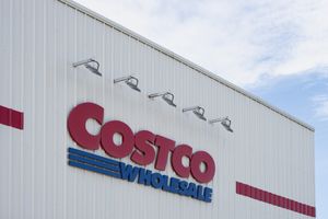 The exterior signage of a Costco Wholesale store showing the brand logo mounted on the building