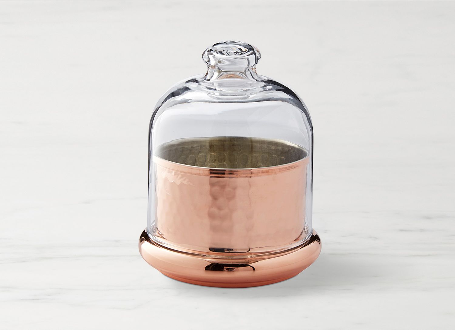 copper butter keeper on a marble surface