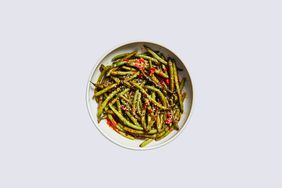 harissa-roasted green beans topped with sesame seeds