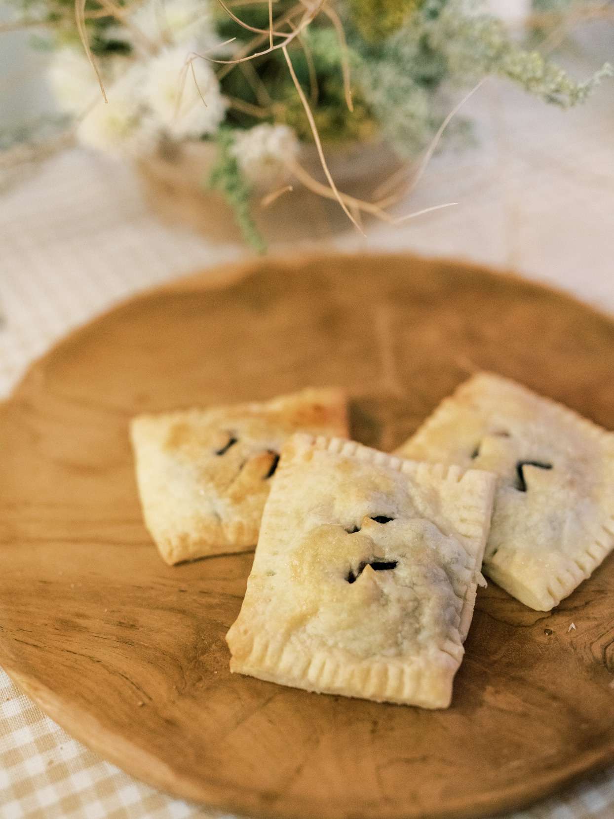 small pastries on wooden tray for wedding food