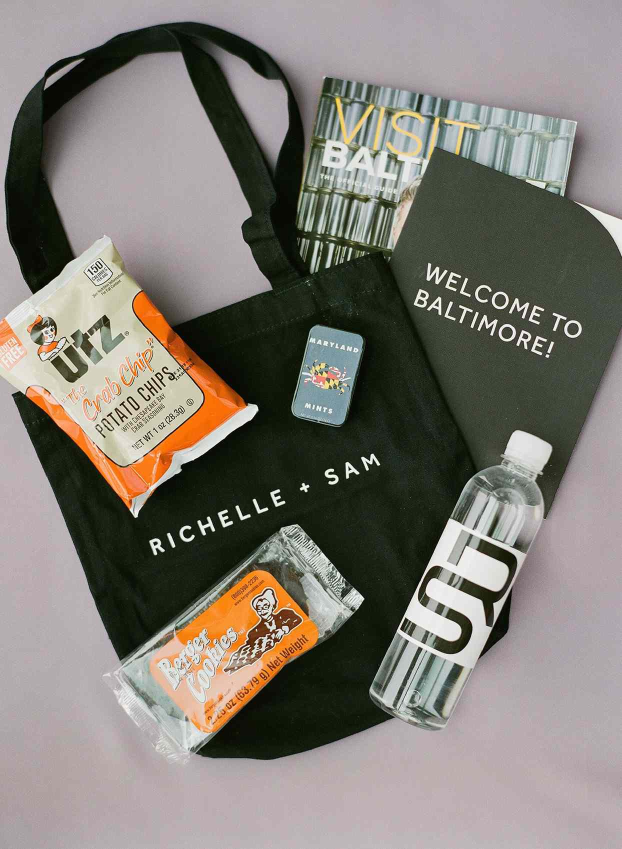 wedding welcome bags with local treats, monogrammed water bottle, and visitor's guide