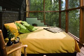 yellow bed on sleeping porch