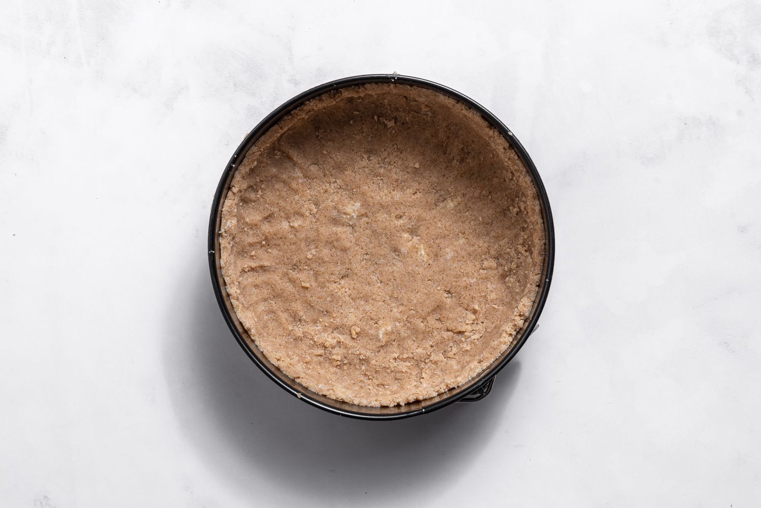 crumb mixture in baking pan for apple pie cake