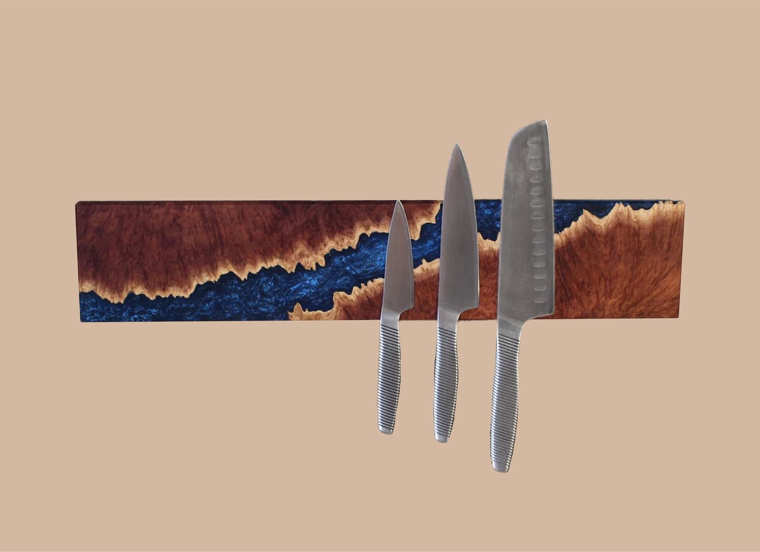 horizontal epoxy river knife rack on a tan background