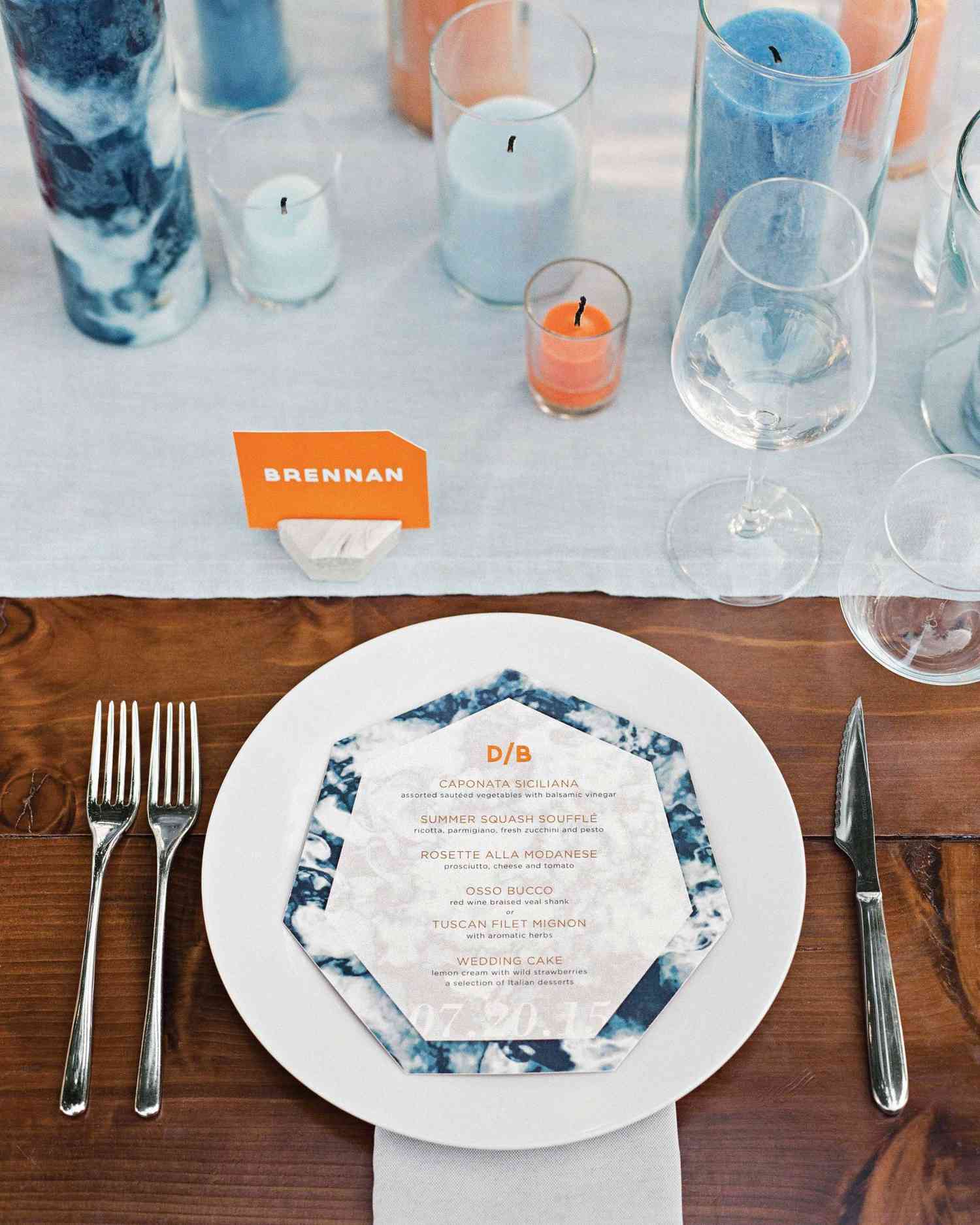 dennis-bryan-wedding-italy-table-setting-menu-orange-blue-candle-centerpiece-004-0531-s112633.jpg