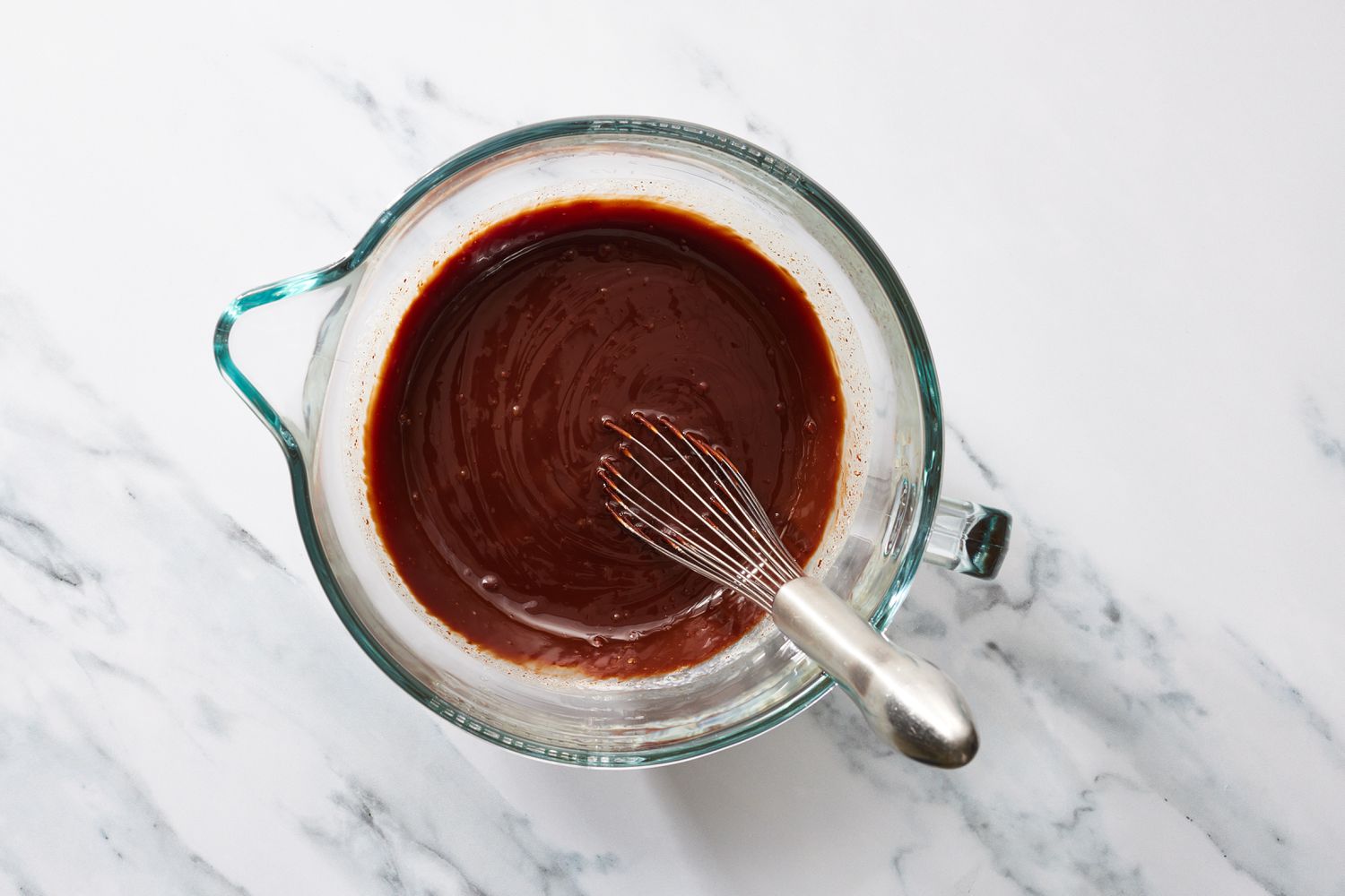 Whisk in melted chocolate in a glass bowl