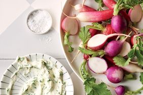 overhead view of radishes and herb dip
