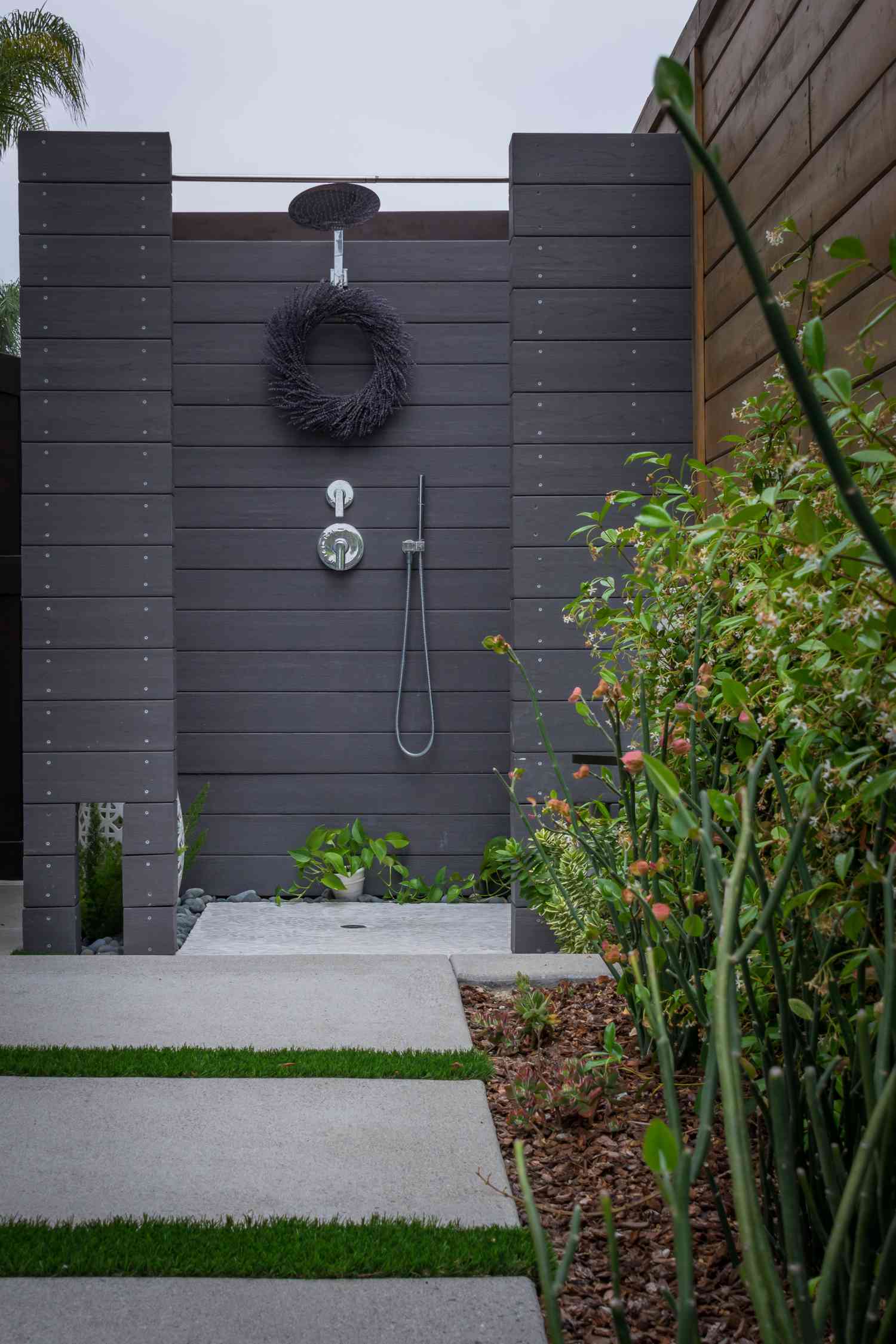 Outdoor shower with a sleek, minimalist design.