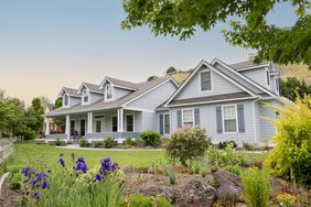 blue house with green lawn