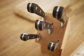 wooden knife block holding knives