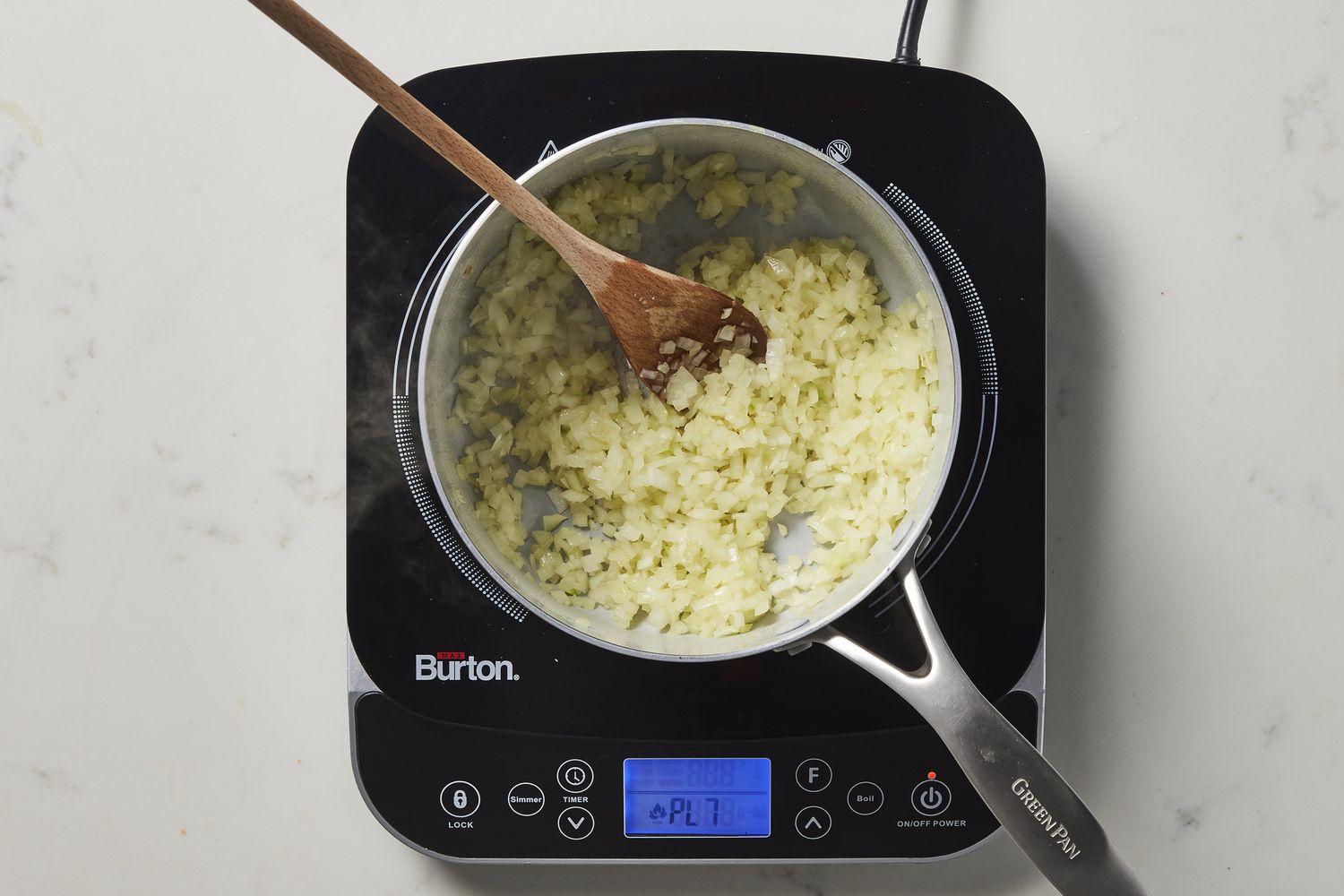 Onion and garlic sautÃ©ing in pan