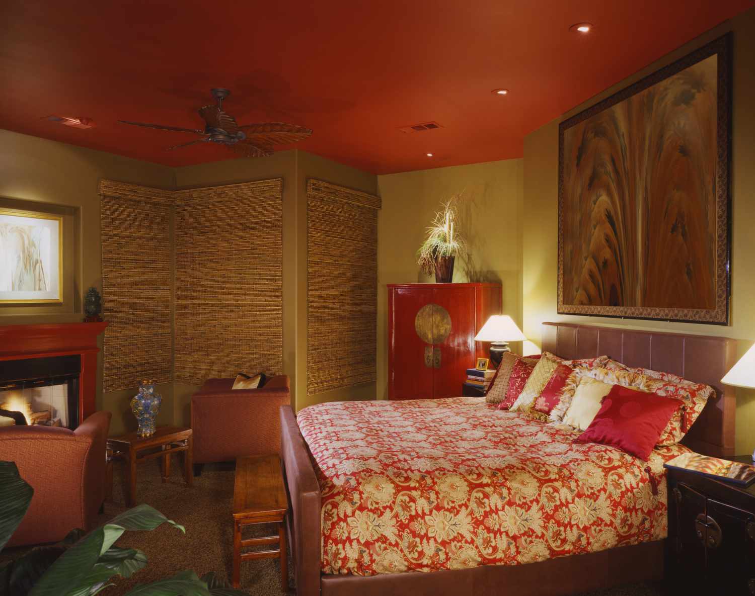 a bedroom with a red ceiling