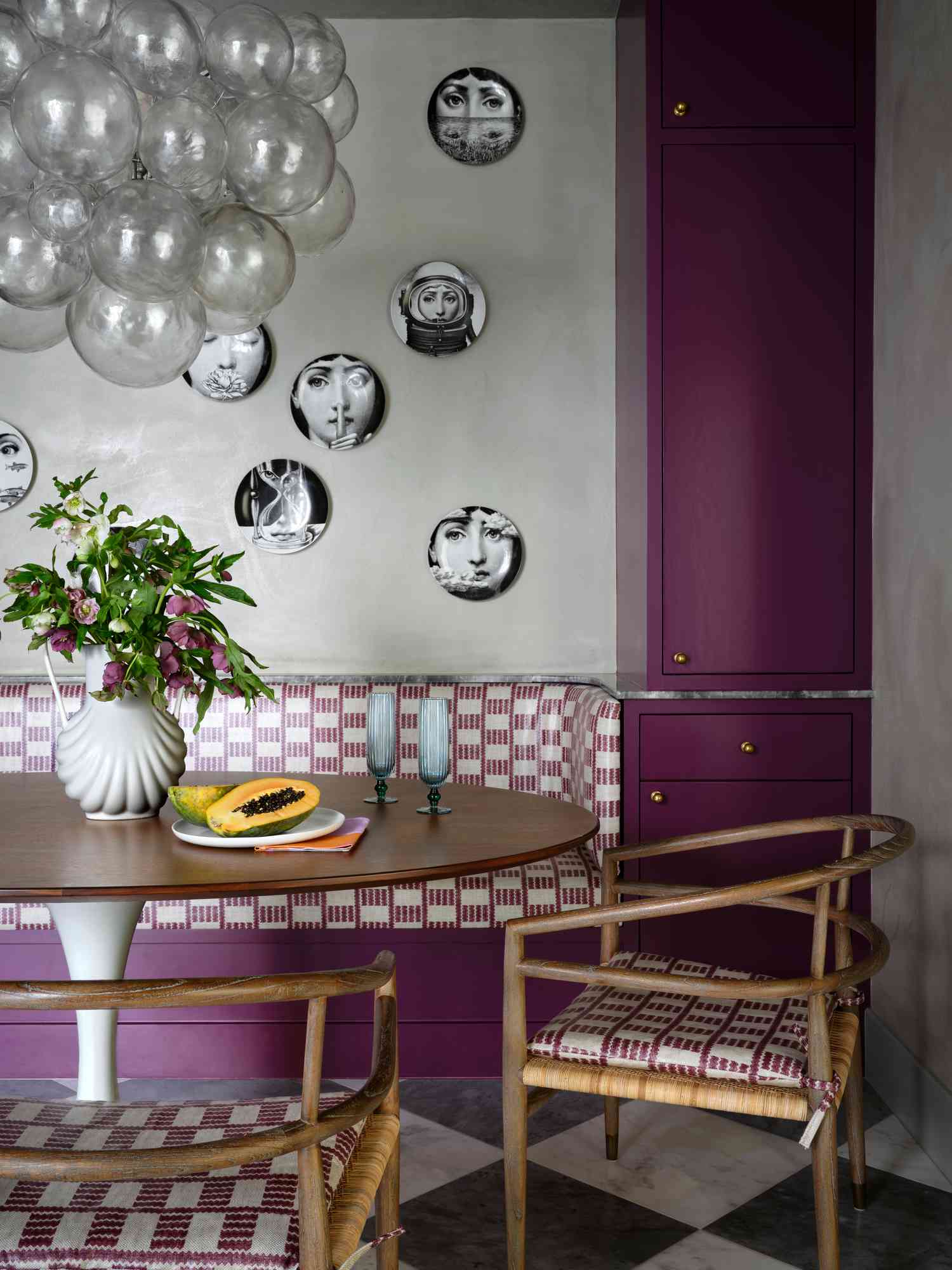 a dining room area with purple accents