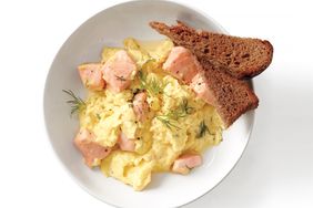overhead view of salmon and scrambled eggs with toast