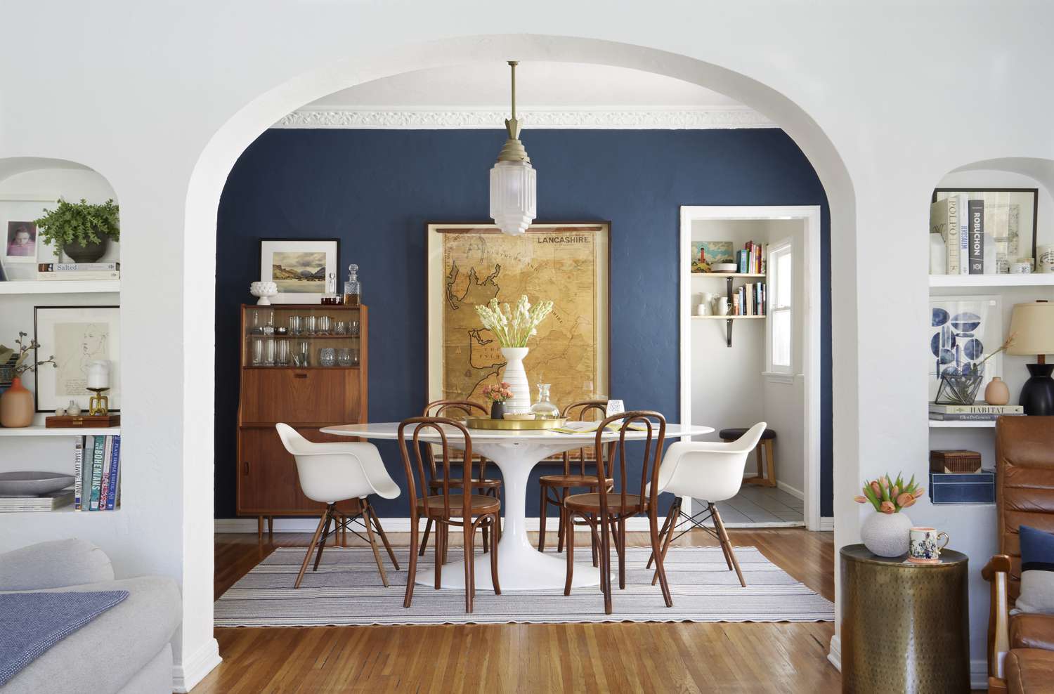 Dining room with dark blue accent wall