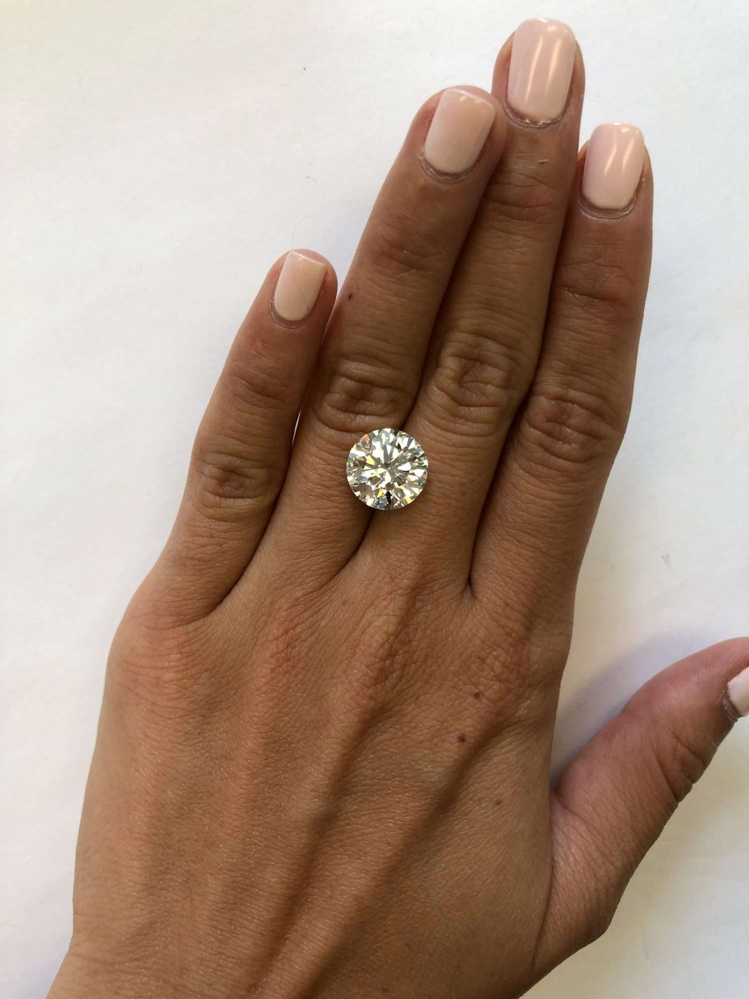 hand with 5 carat diamond