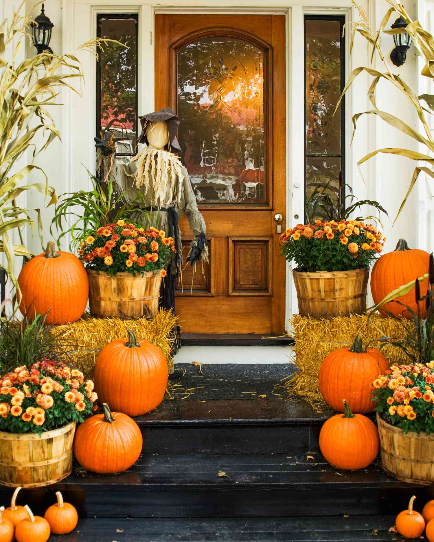 Orange mums and pumpkin decor