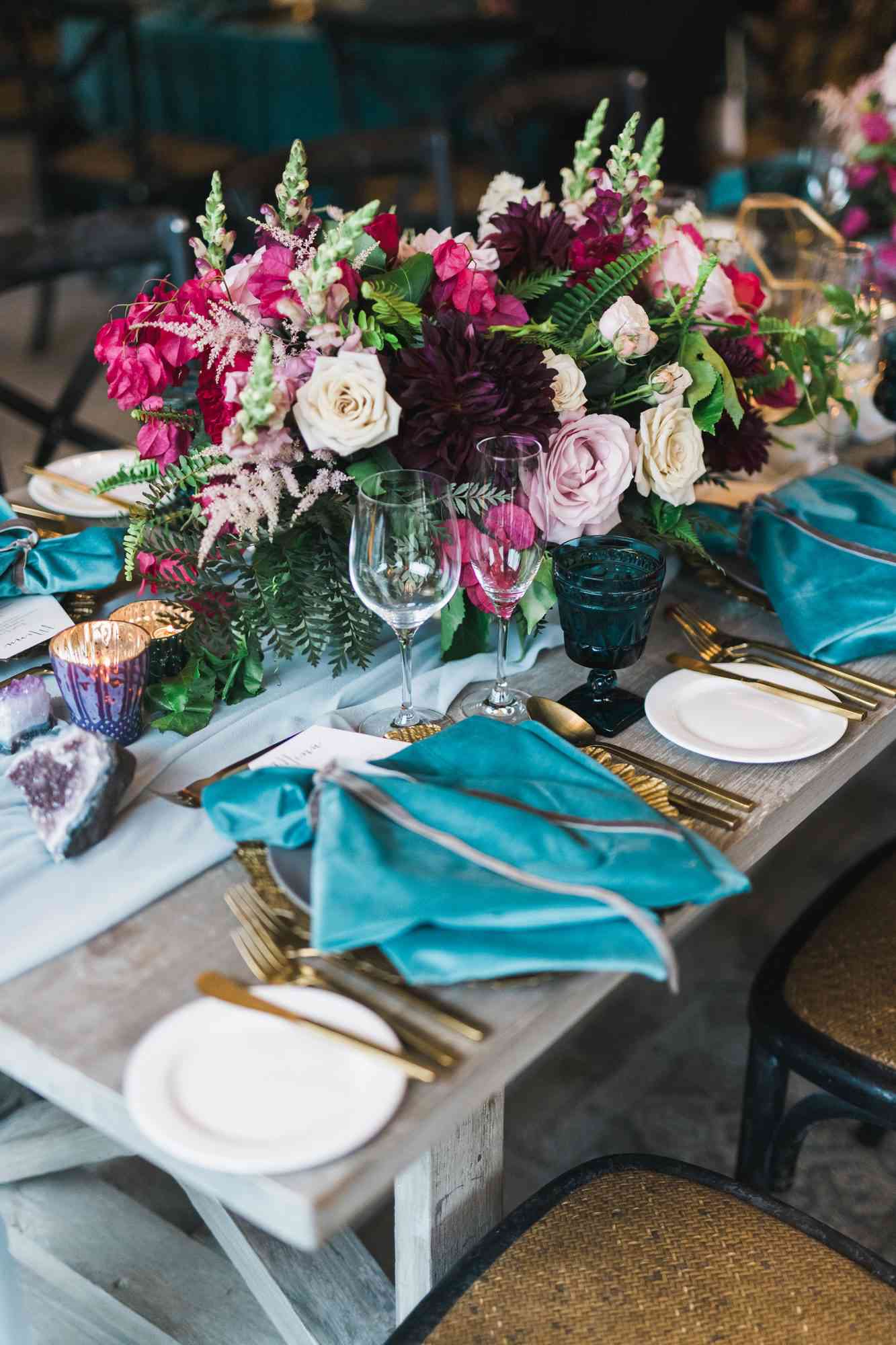 jewel-toned centerpiece with garden roses and dahlias
