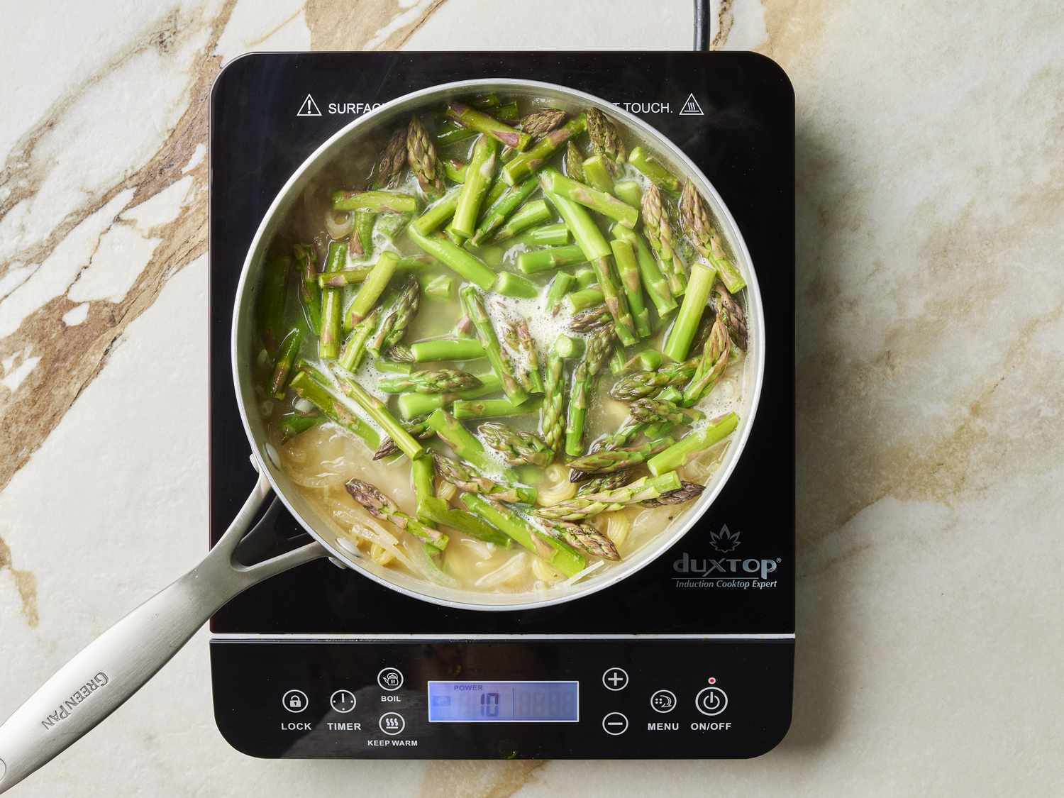 Asparagus and shallots in pan