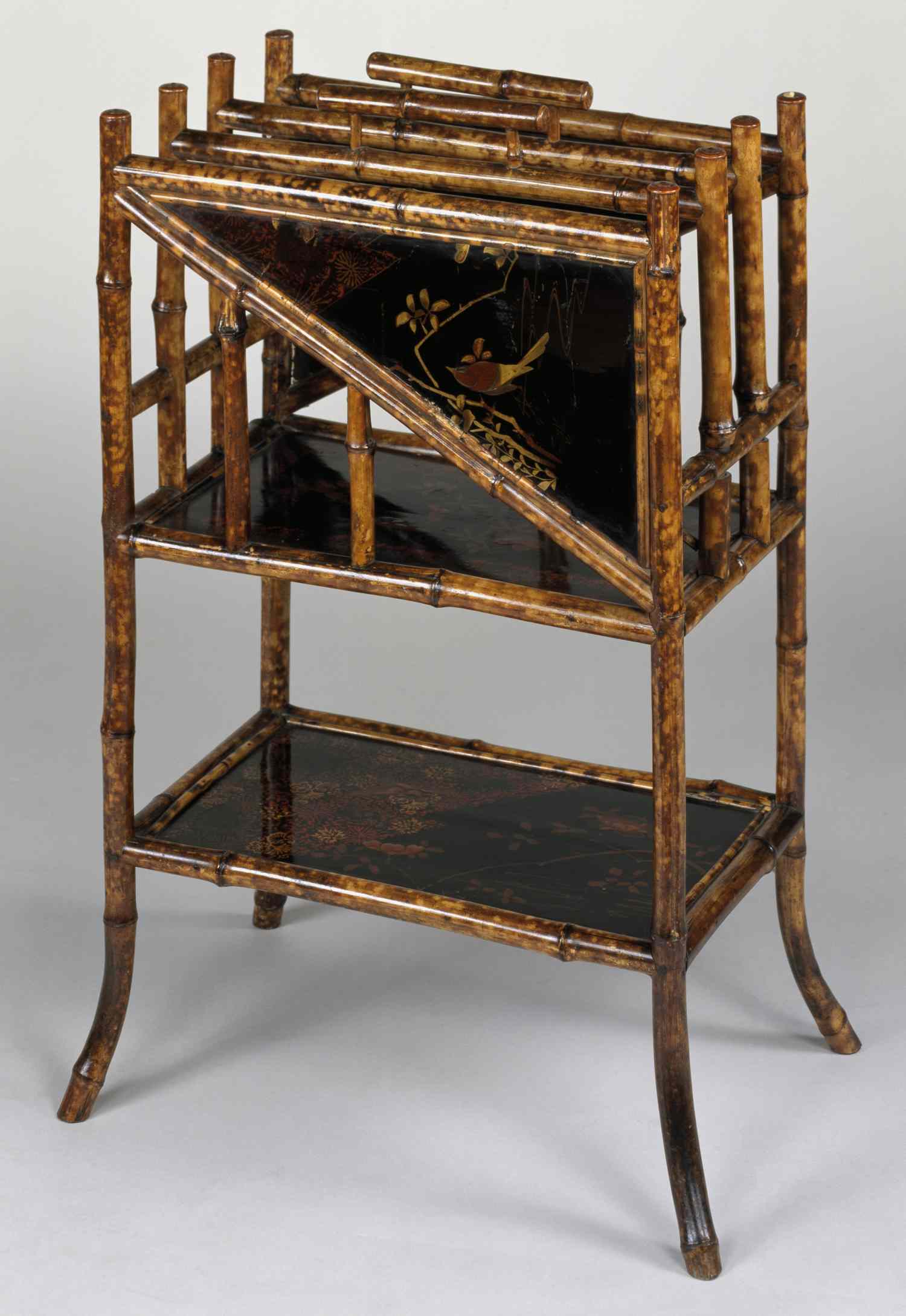 Antique bamboostyle magazine rack with decorative panels