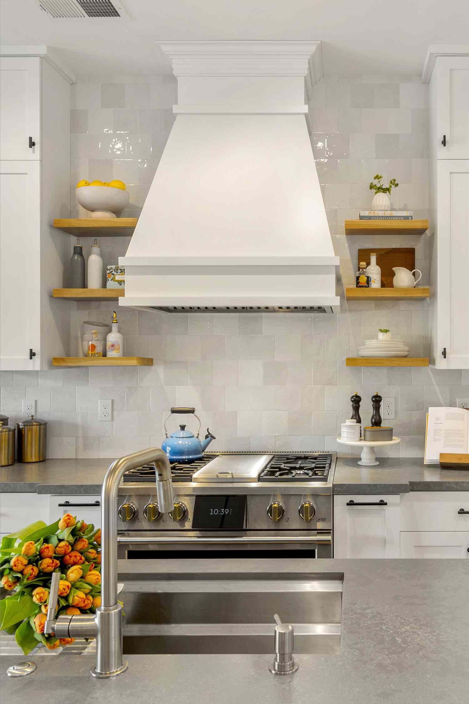 Kitchen with range hood and wood shelves