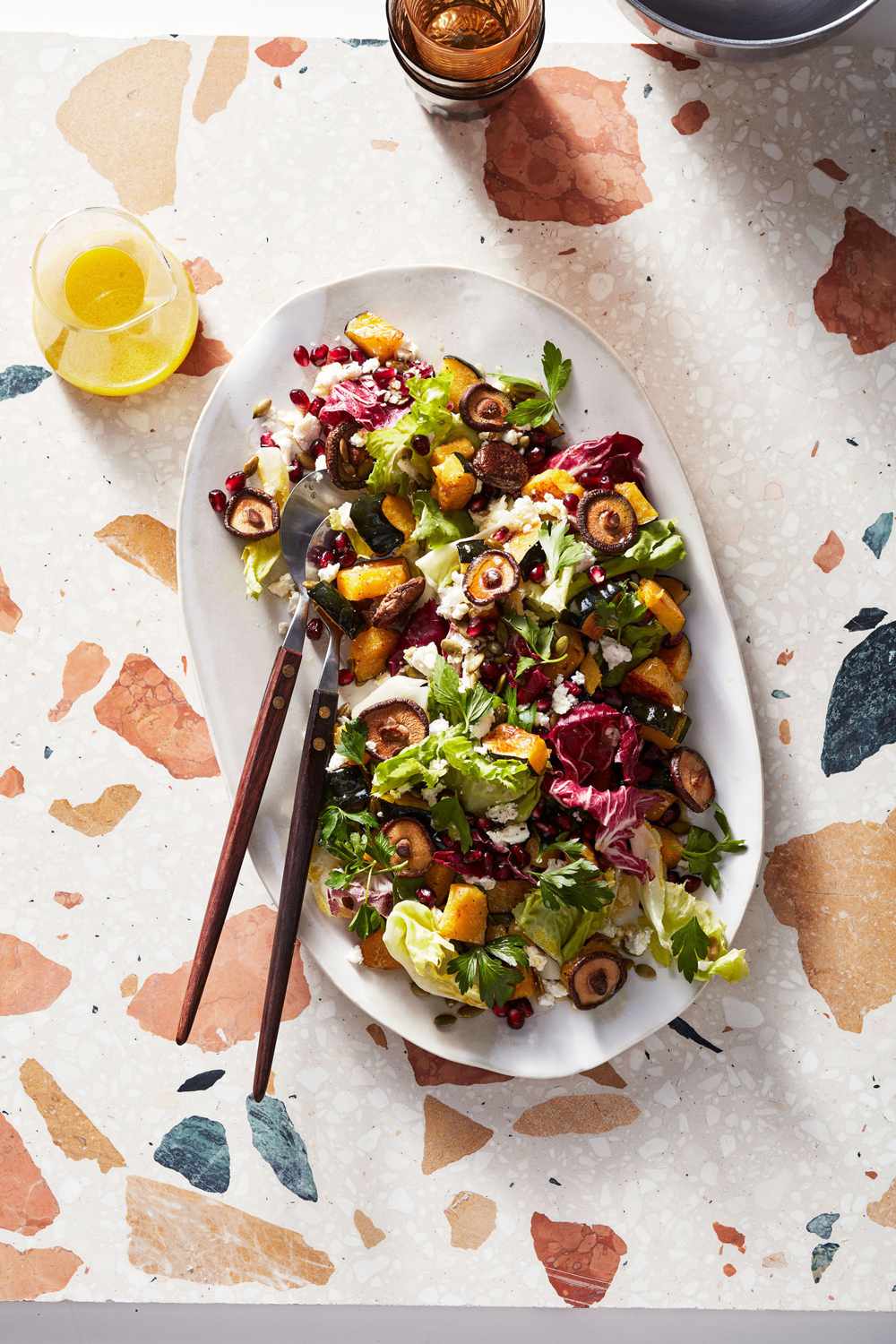 chopped winter salad with mushrooms and pomegranate