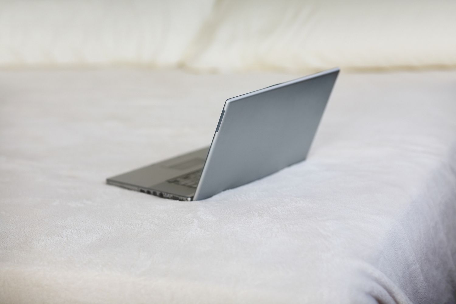 Laptop on bed