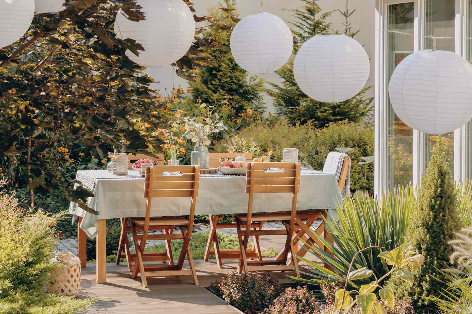 Paper lanterns hanging above a patio table
