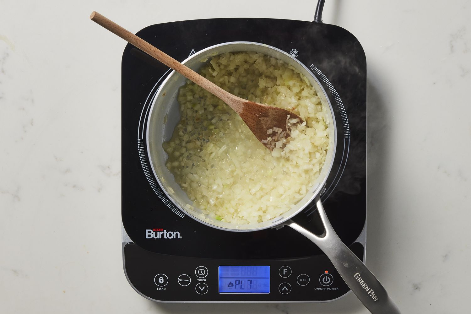 Wine, onion and garlic in skiller