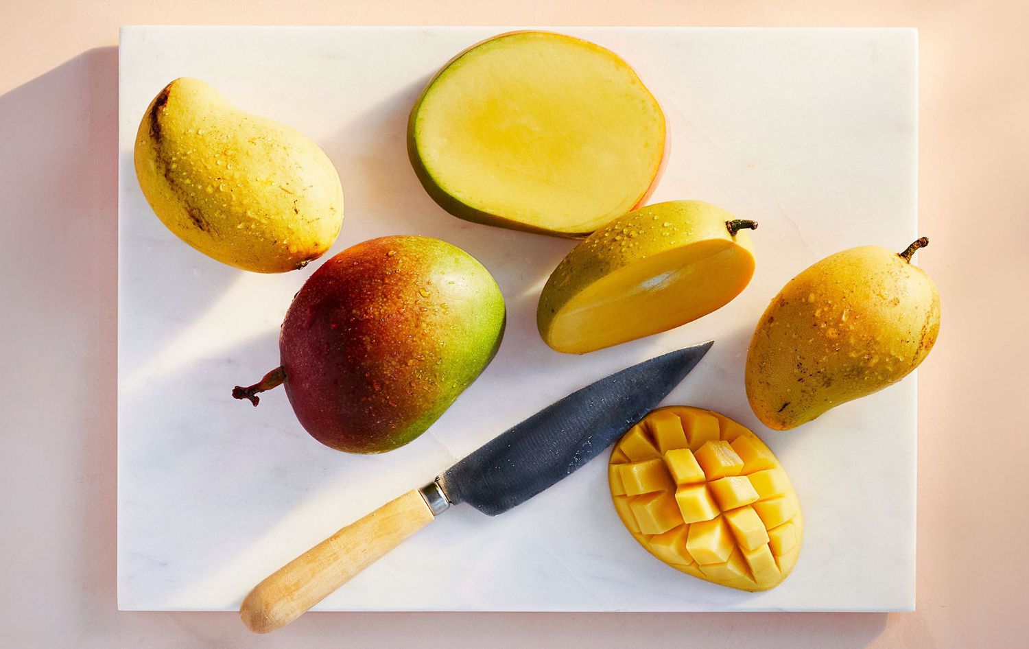Mangoes on cutting board