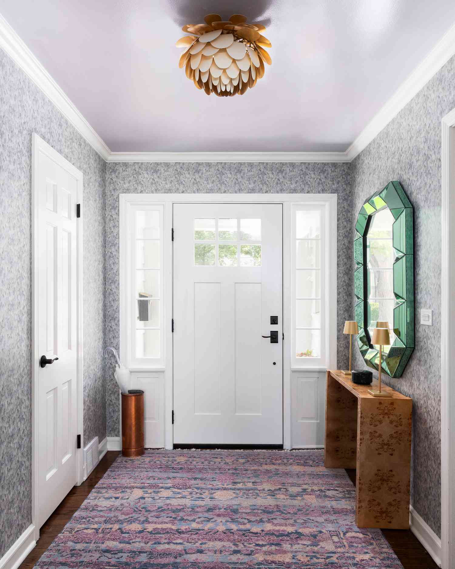 An entryway with wallpaper