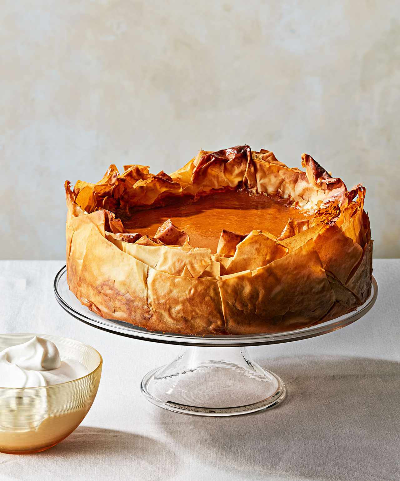 five spice pumpkin pie with phyllo crust on stand