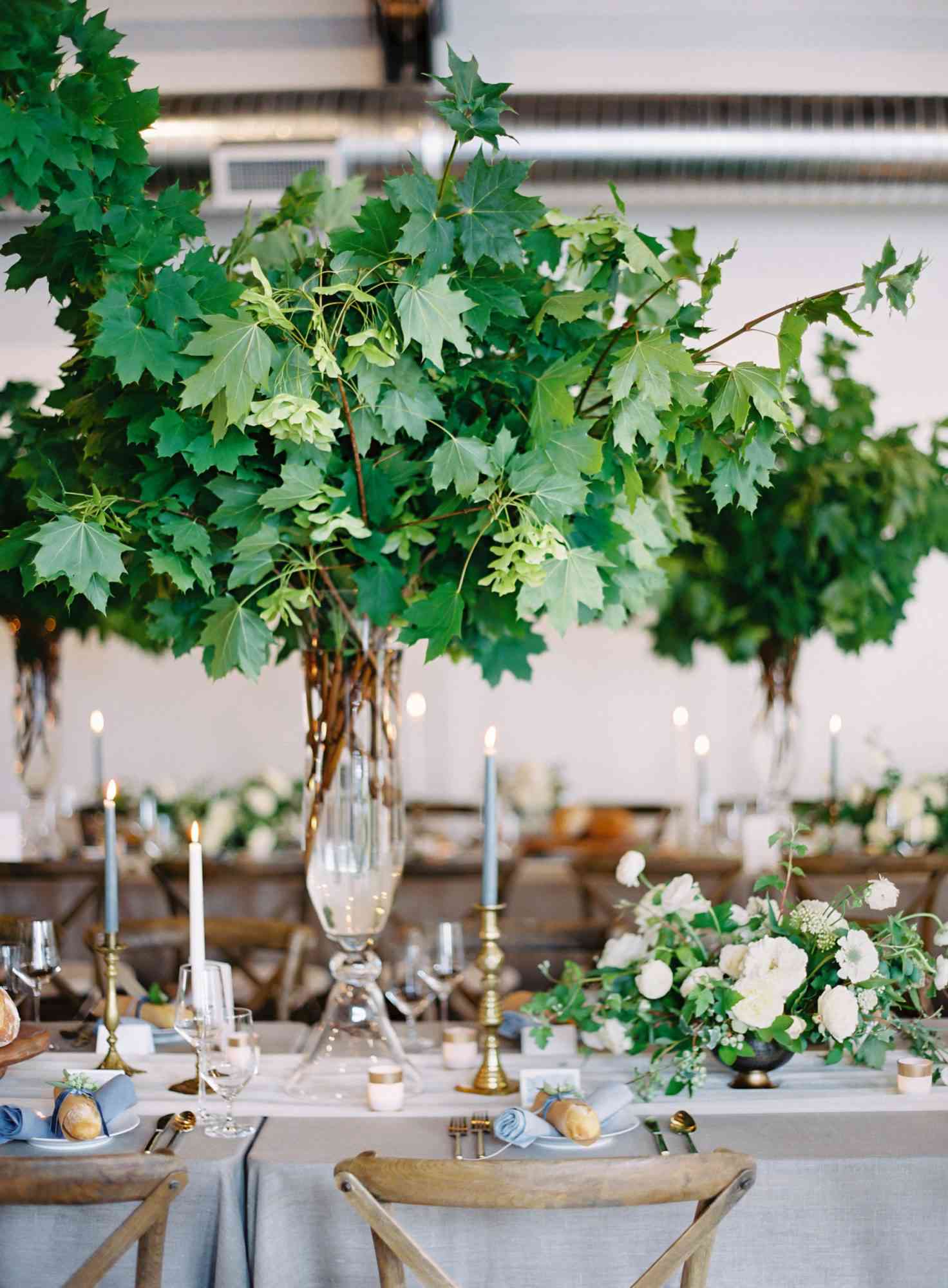 tall centerpiece with greenery