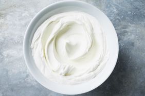 blue and gray background with a bowl of sour cream