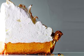close up of pumpkin pie with lots of meringue