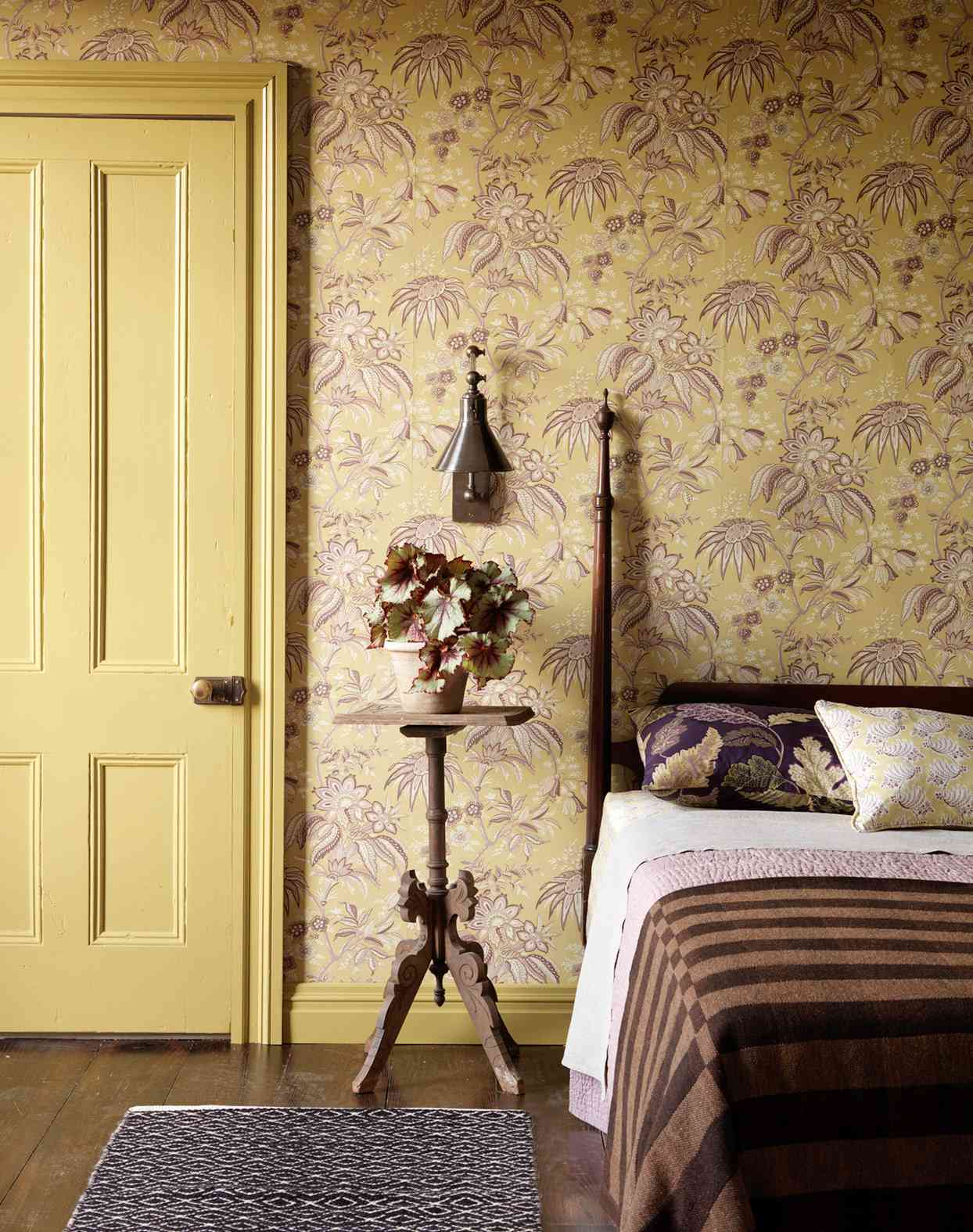 yellow and violet wallpapered bedroom