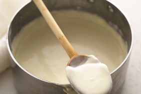 white sauce in metal pot