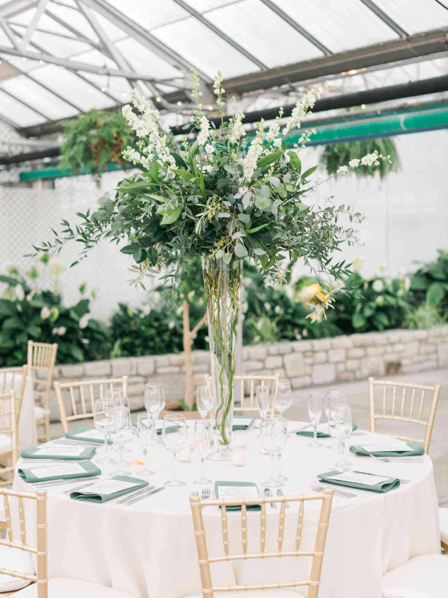 tall centerpiece with greenery