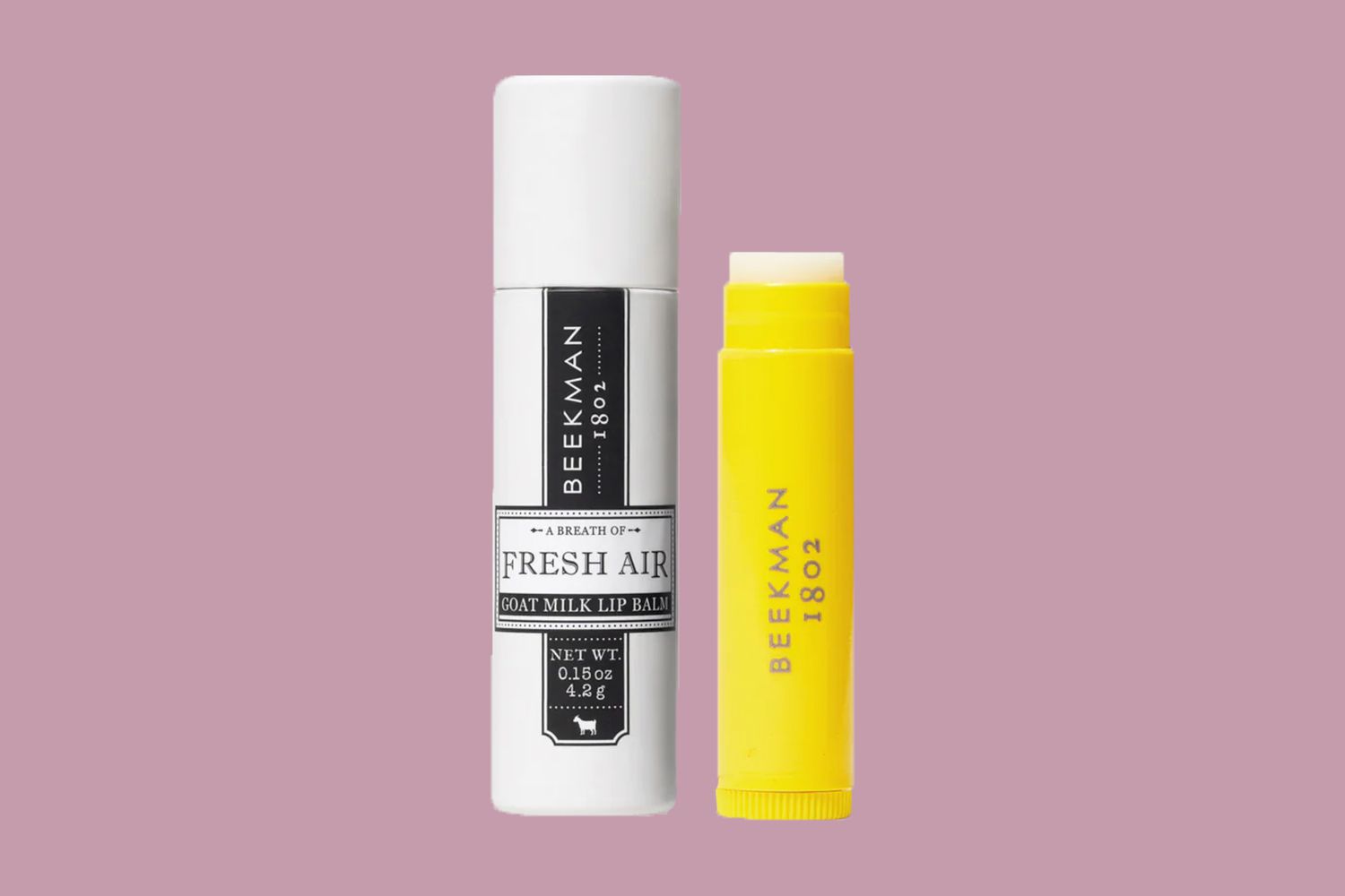 beekman lip balm on a pink background